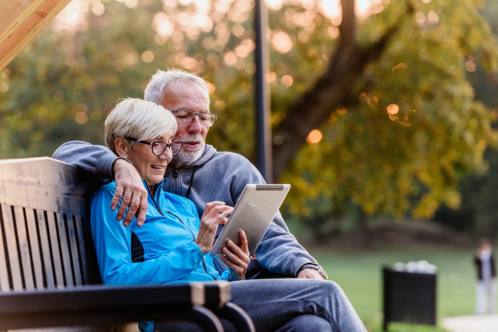 reading CBD Wellness' blogs and articles in the park