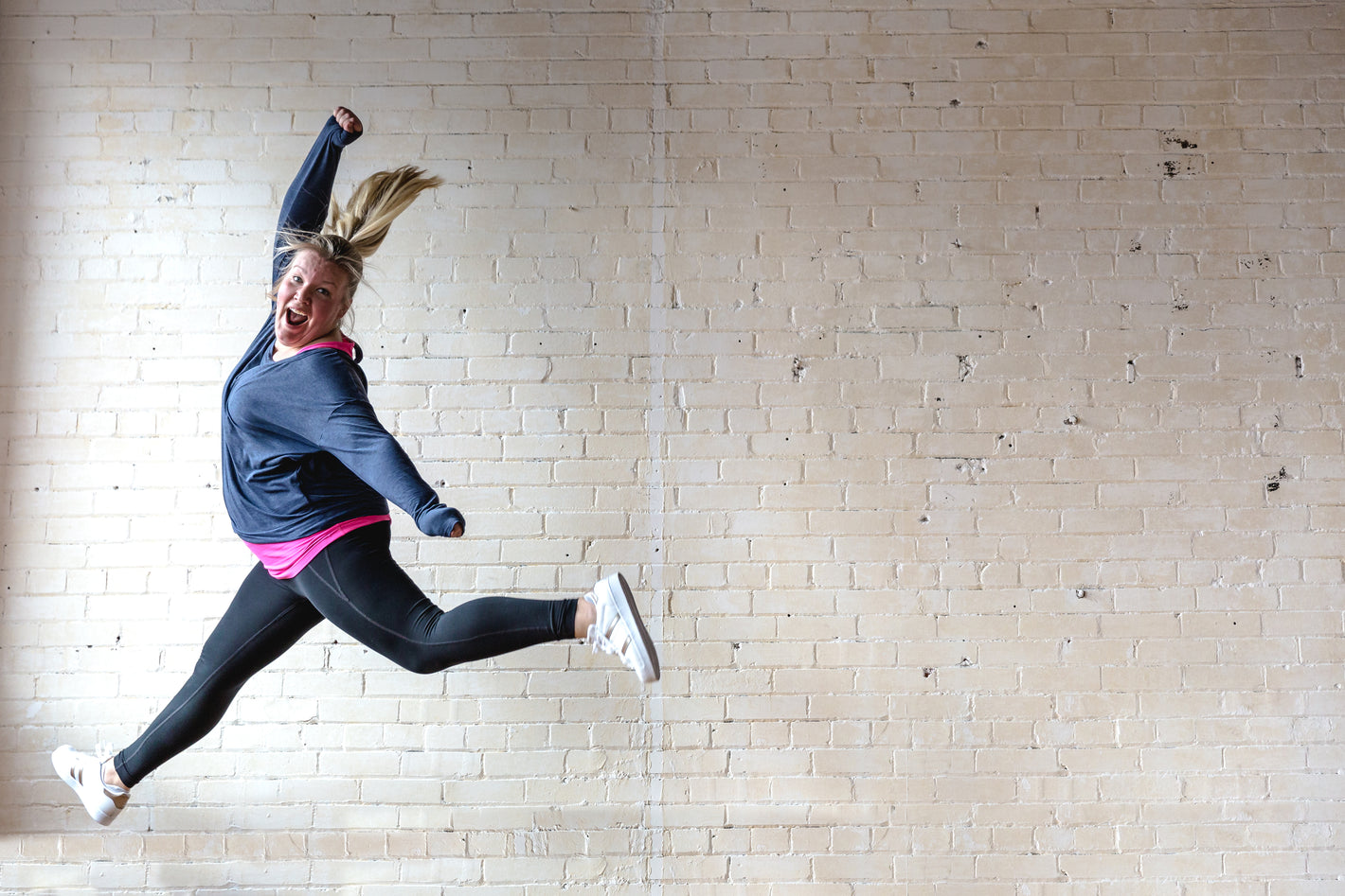 Jumping with joy after she used CBD Wellness menthol liniment spray