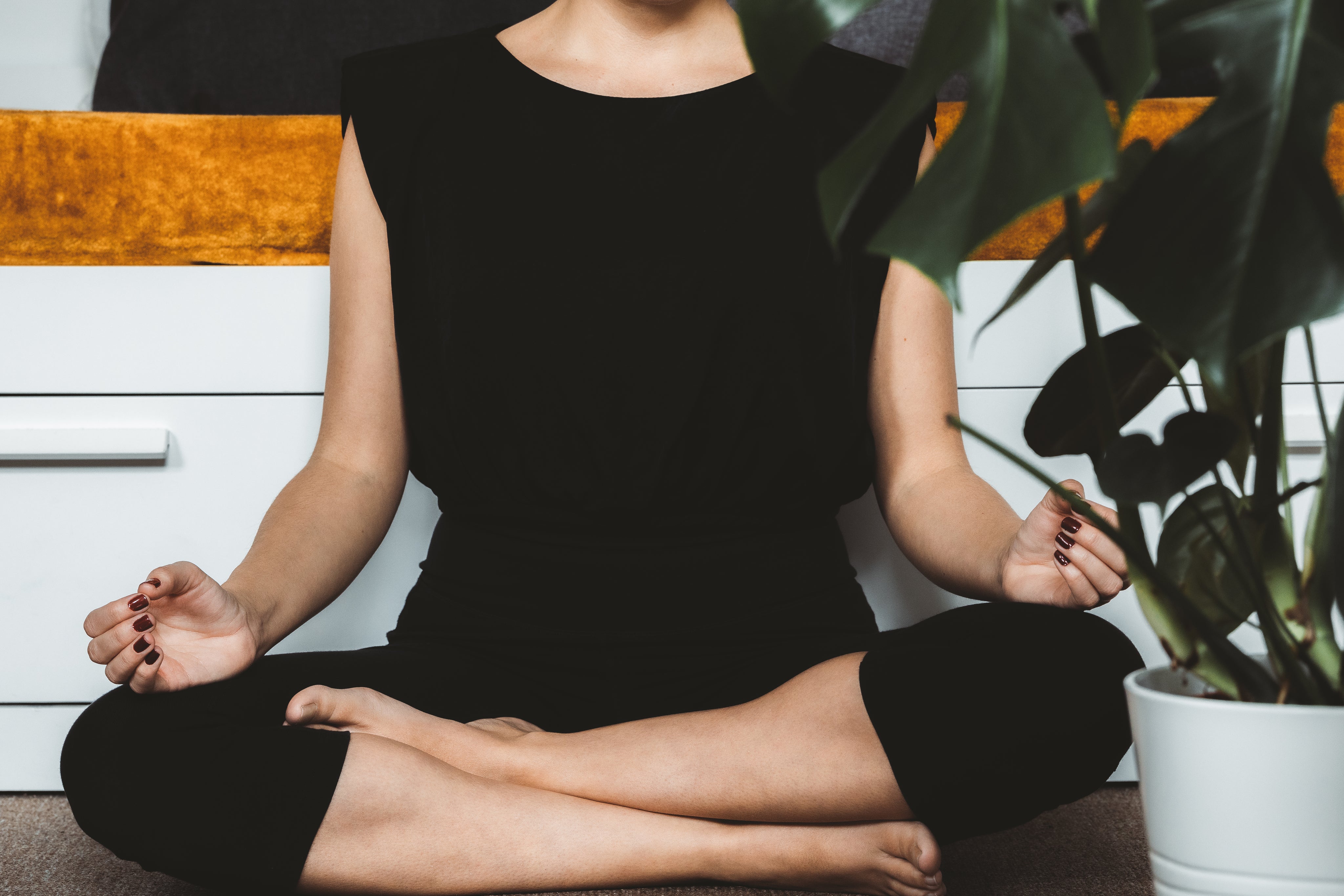Person meditating for anxiety and stress relief with CBD
